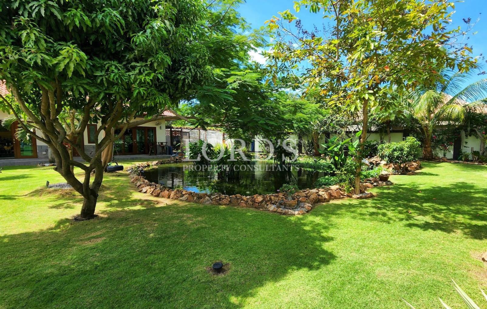 Covered patio with seating and garden view