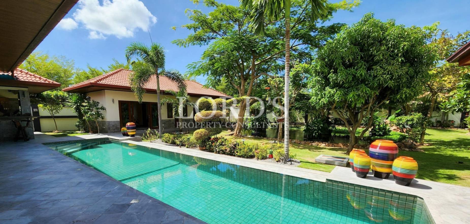 Pool with garden and tropical landscaping