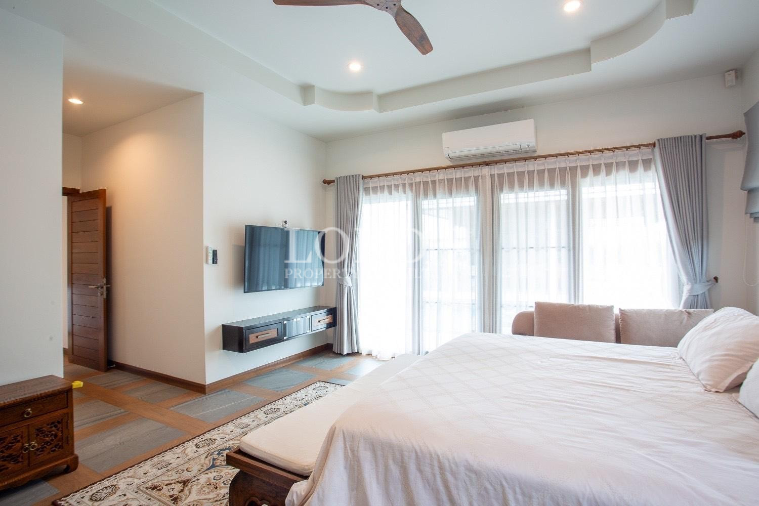 Bedroom with air conditioning unit
