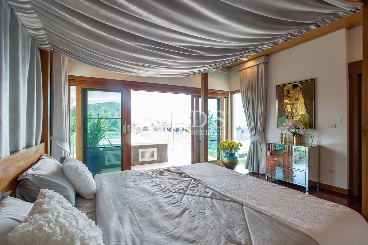 Bedroom with canopy bed and wooden design