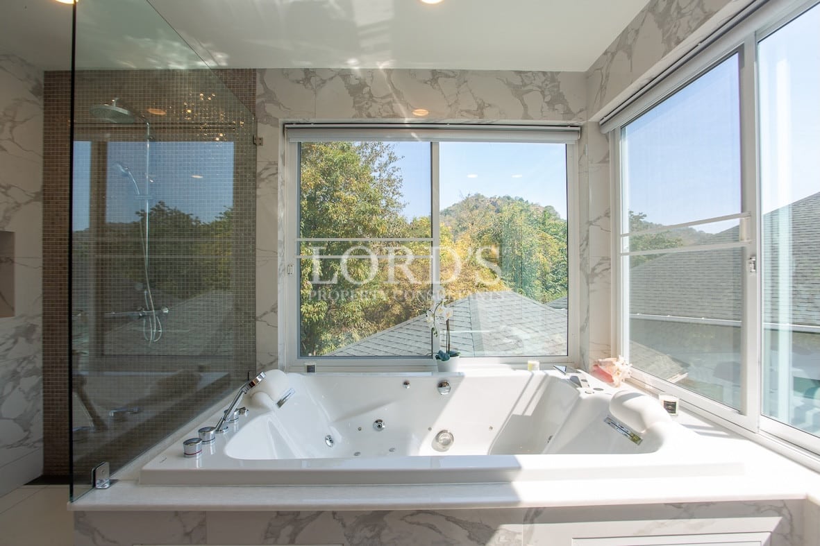 Bathroom with bathtub and window view