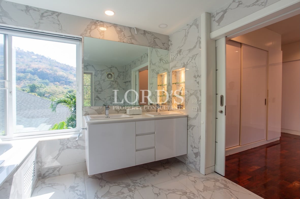 Bathroom with vanity and storage cabinets