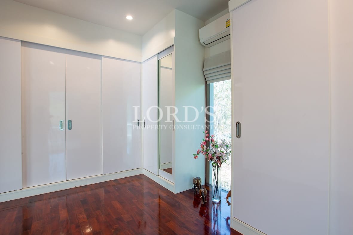 Bedroom with wardrobe and wooden flooring