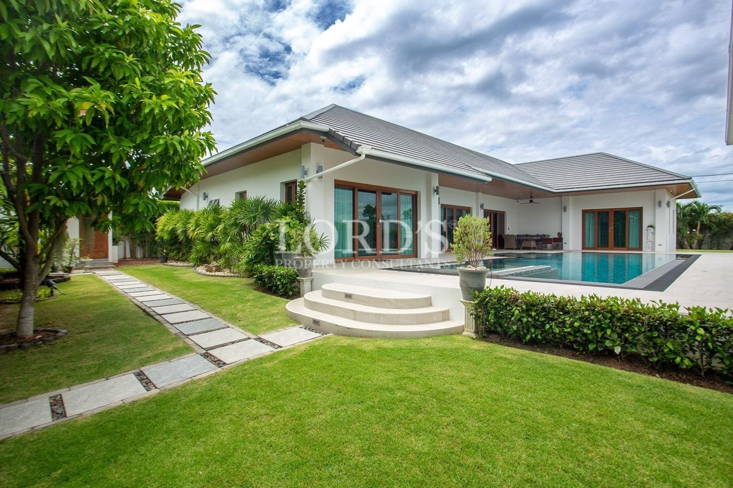 House with green lawn and entrance
