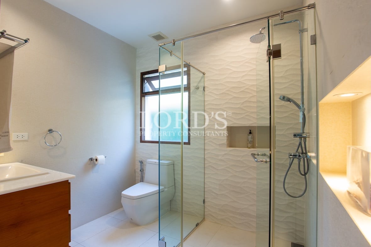 Bathroom with toilet and glass shower