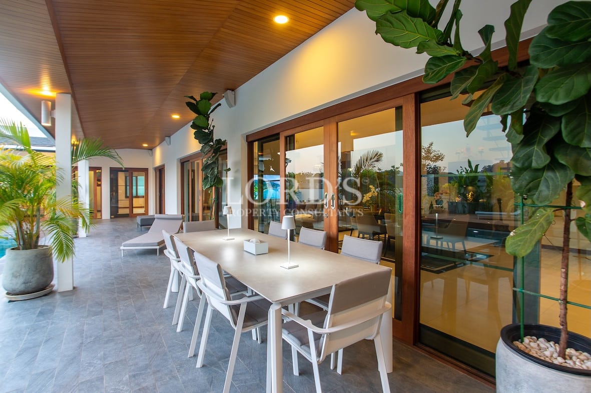 Outdoor dining area under covered terrace