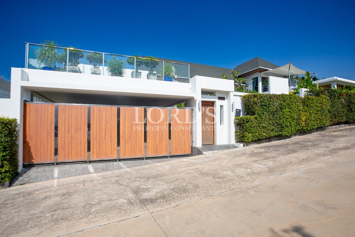 House exterior with driveway and gate