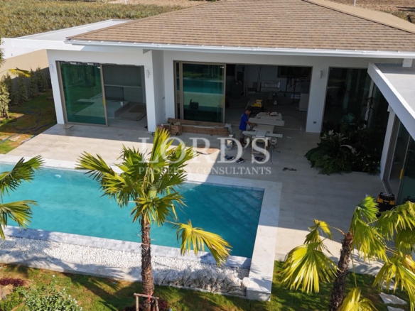 Poolside exterior with modern villa