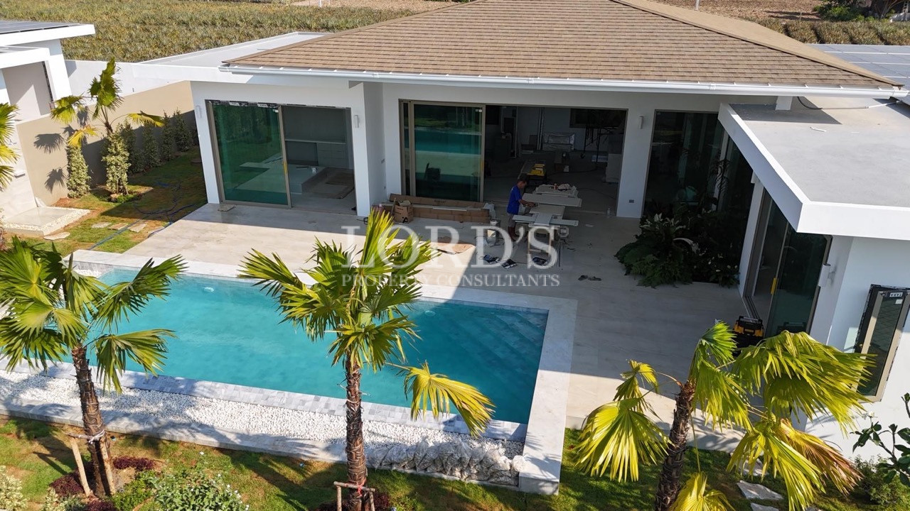 Poolside exterior with modern villa