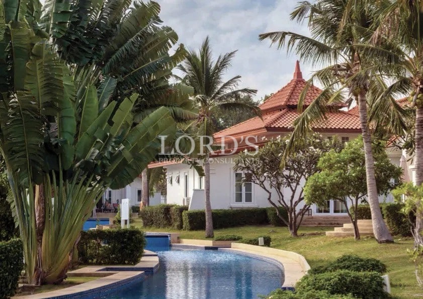 Luxury villa with pool and palm trees