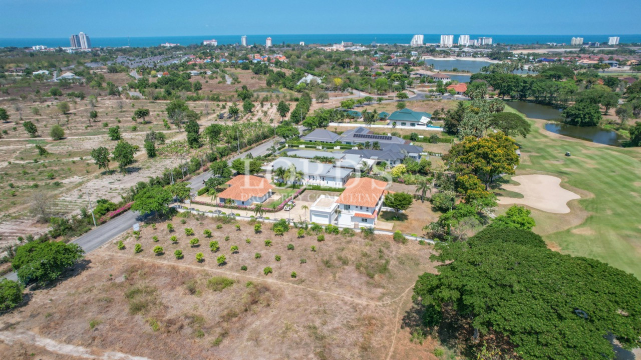Aerial view of villas and orchard land