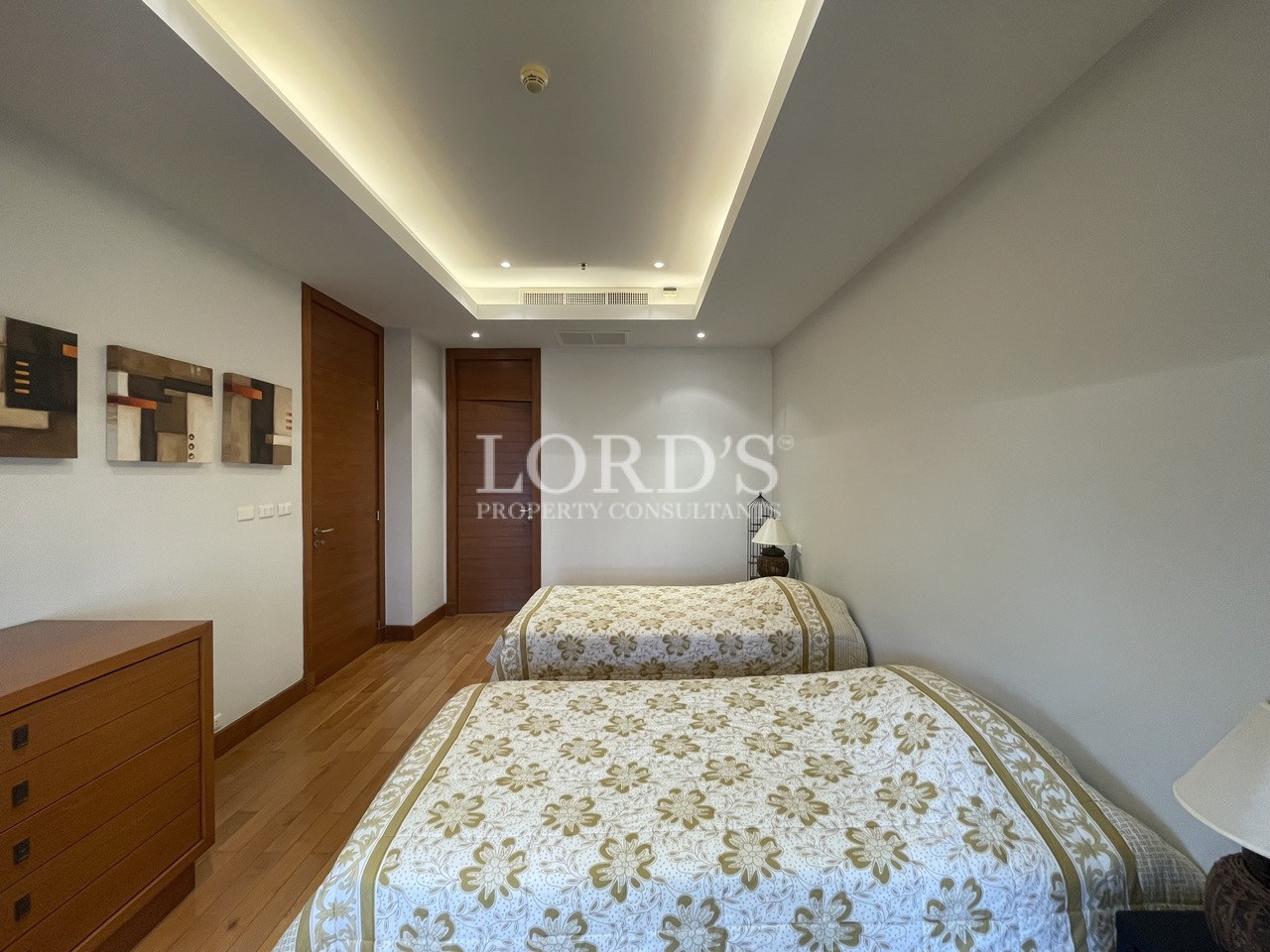 Bedroom with bed and wooden flooring