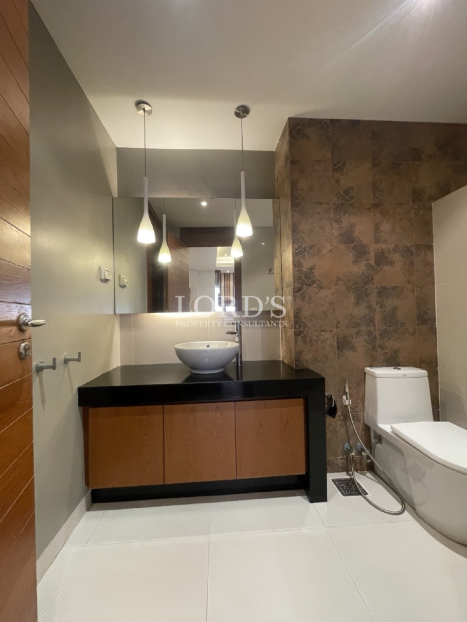 Bathroom with vanity and mirror