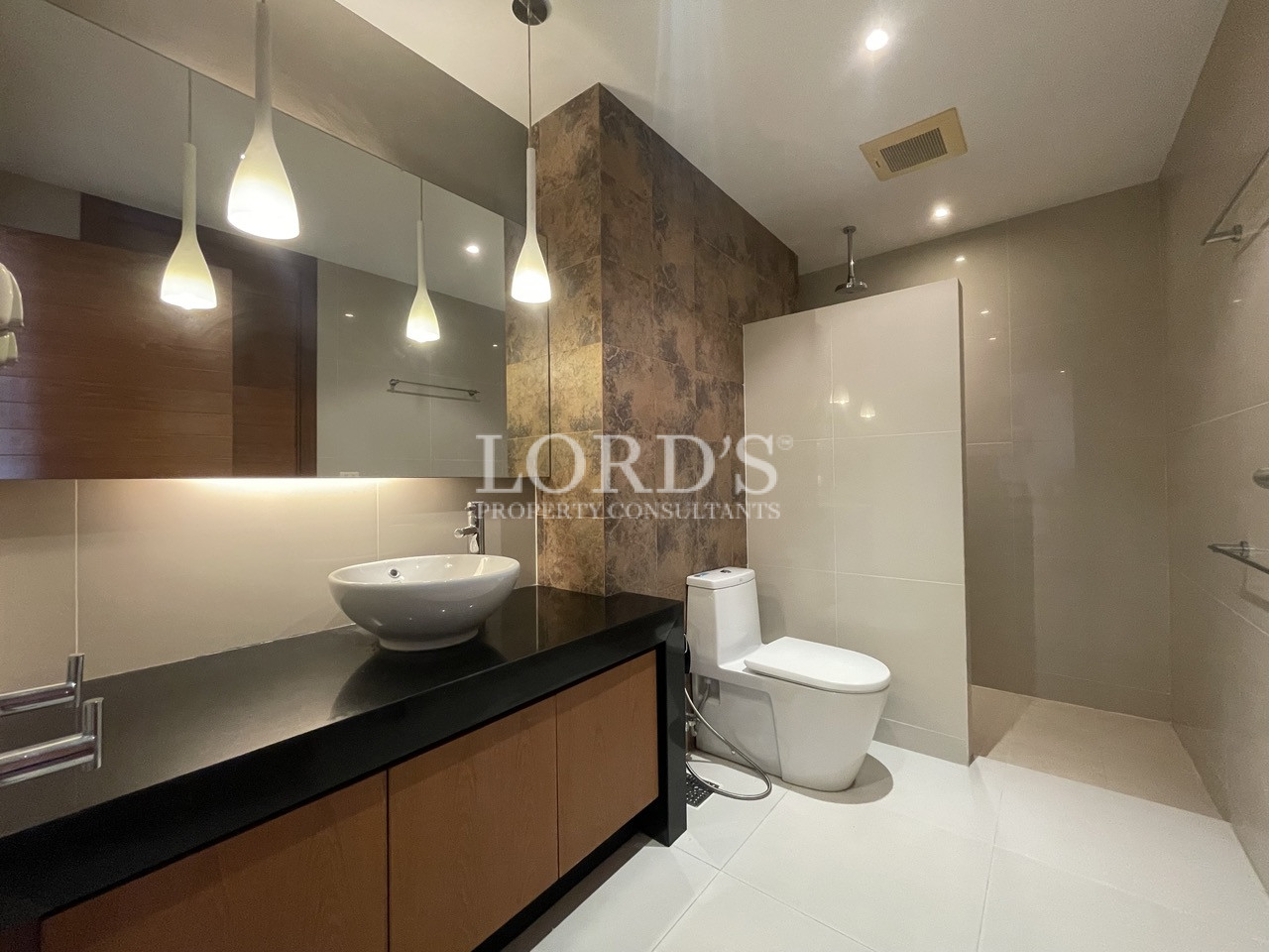 Bathroom with vanity and mirror