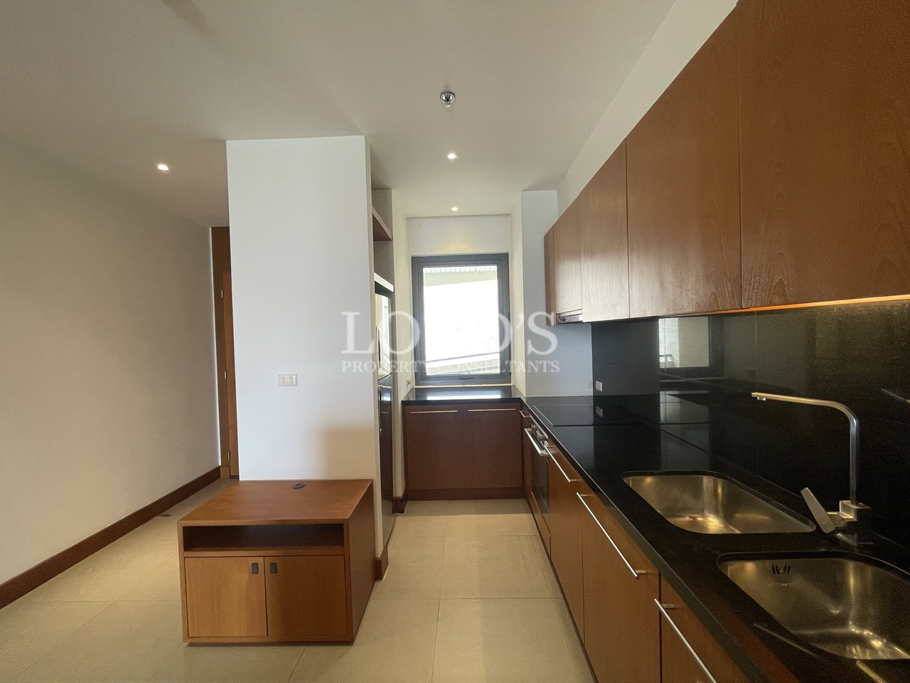 Kitchen with black countertop and wooden cabinets