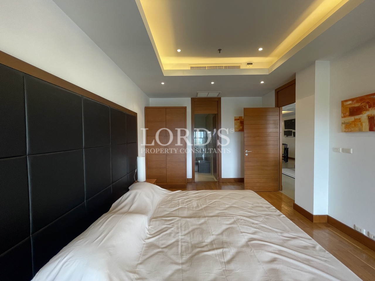 Bedroom with accent wall and bed