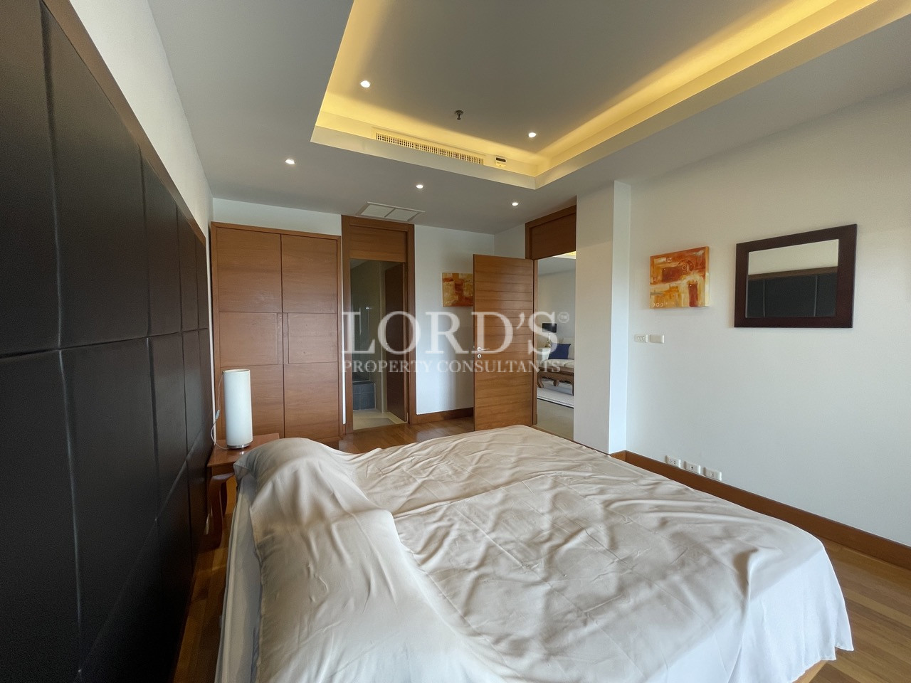 Bedroom with large bed and ceiling lighting