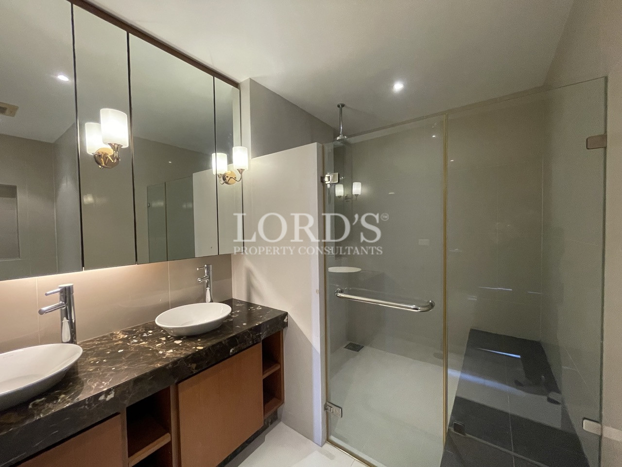 Bathroom with vanity and glass shower