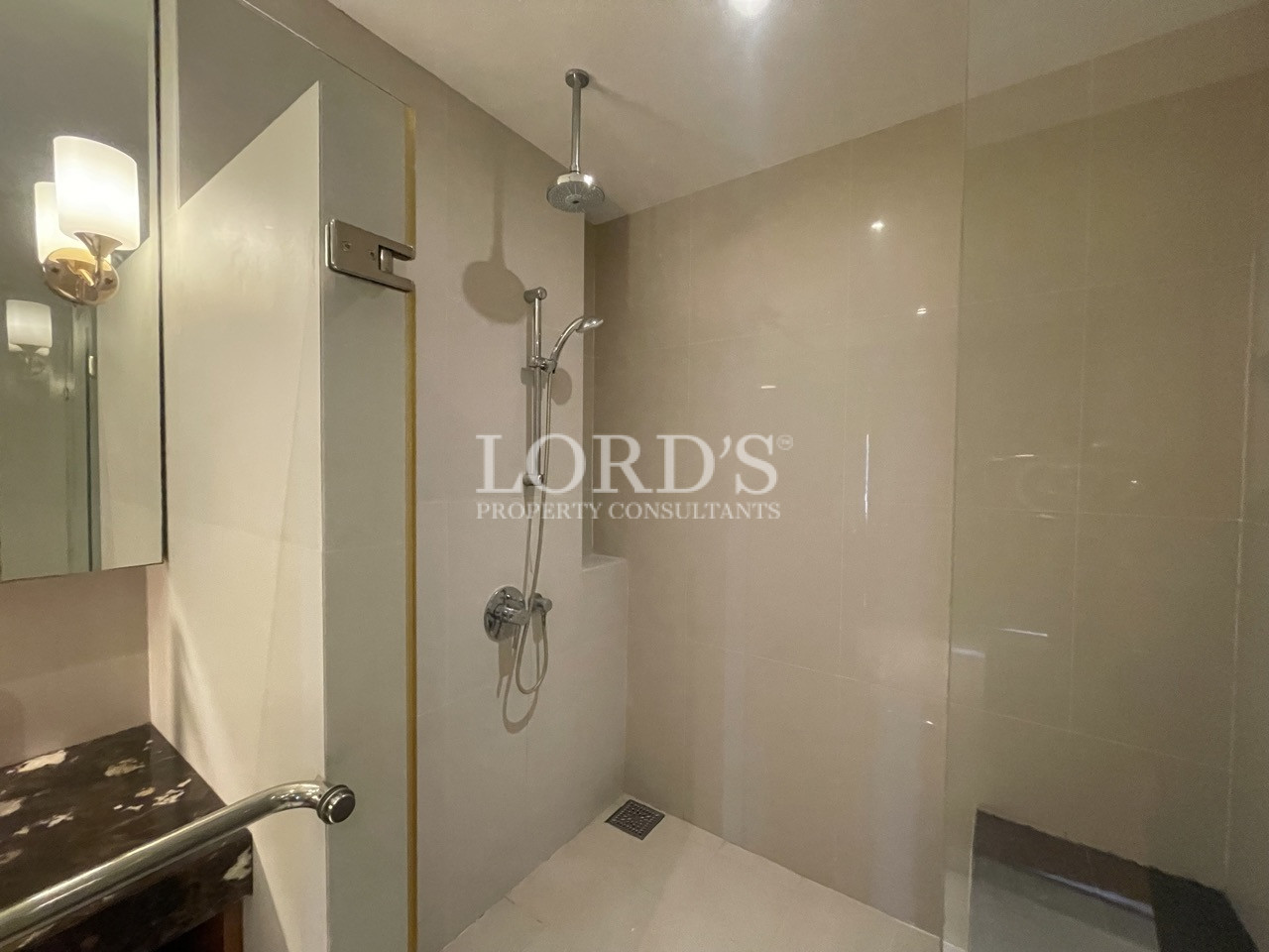 Bathroom with shower area and fixtures