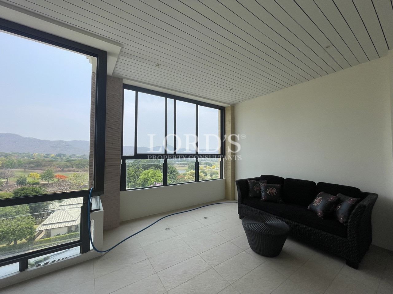 Room with large windows and seating