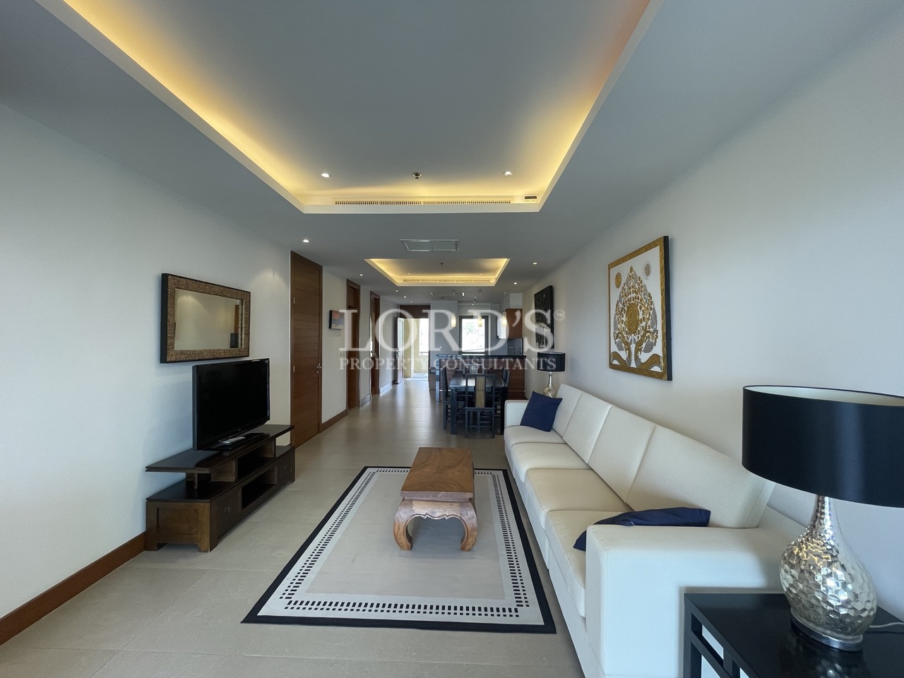 Covered balcony with seating and view