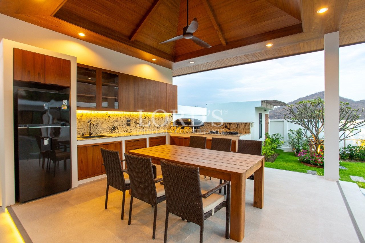 outdoor dining area with wooden table