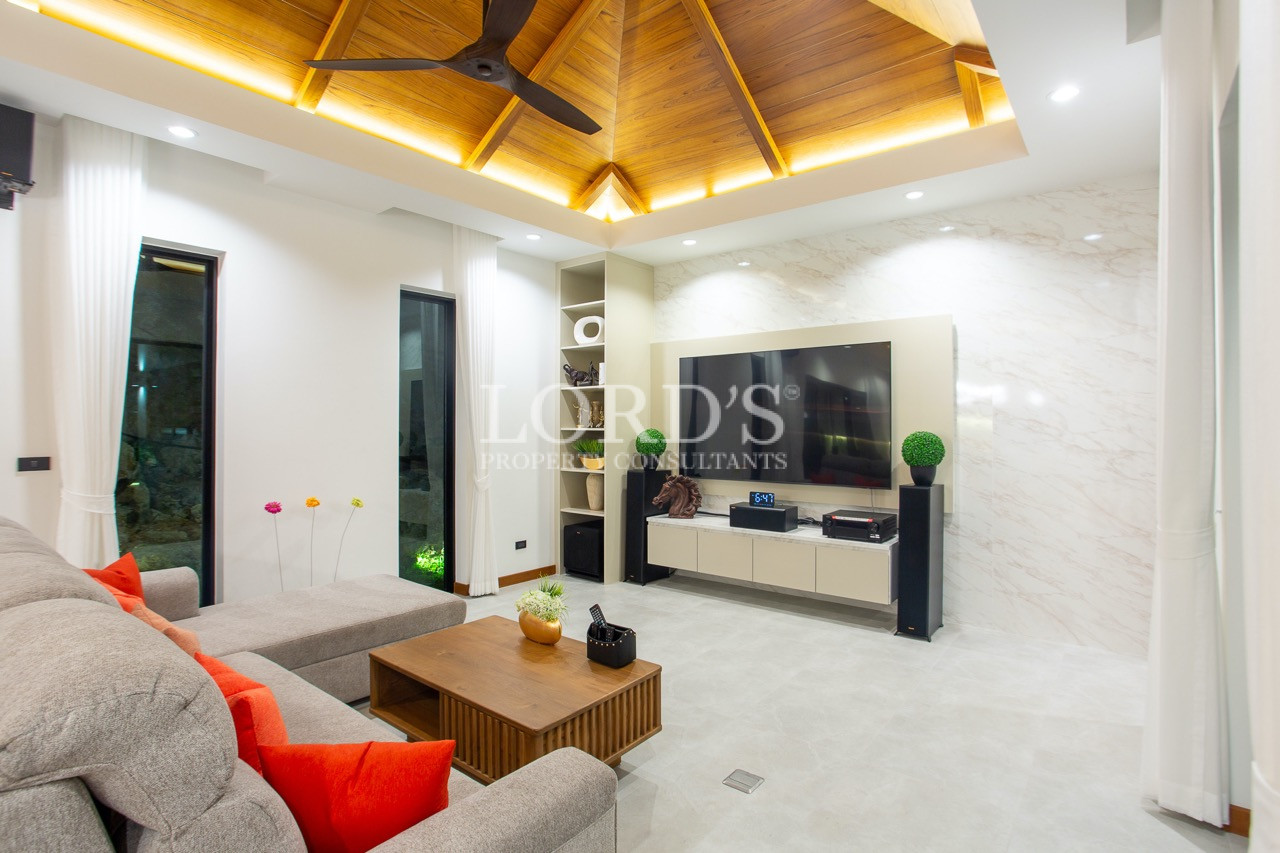living room with wooden ceiling decor