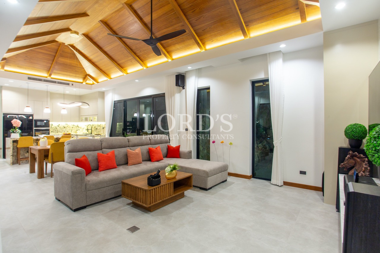 living room with wooden ceiling design