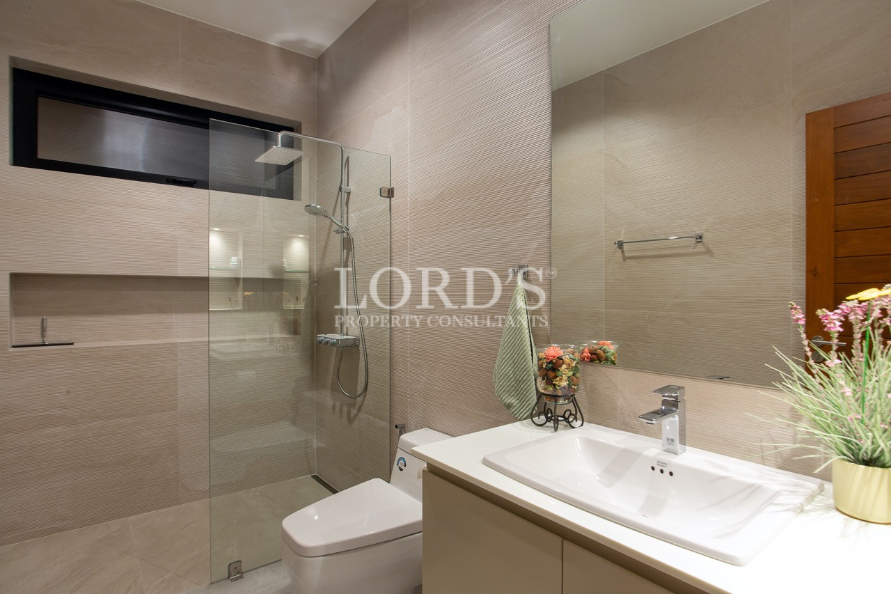 bathroom with glass shower and vanity