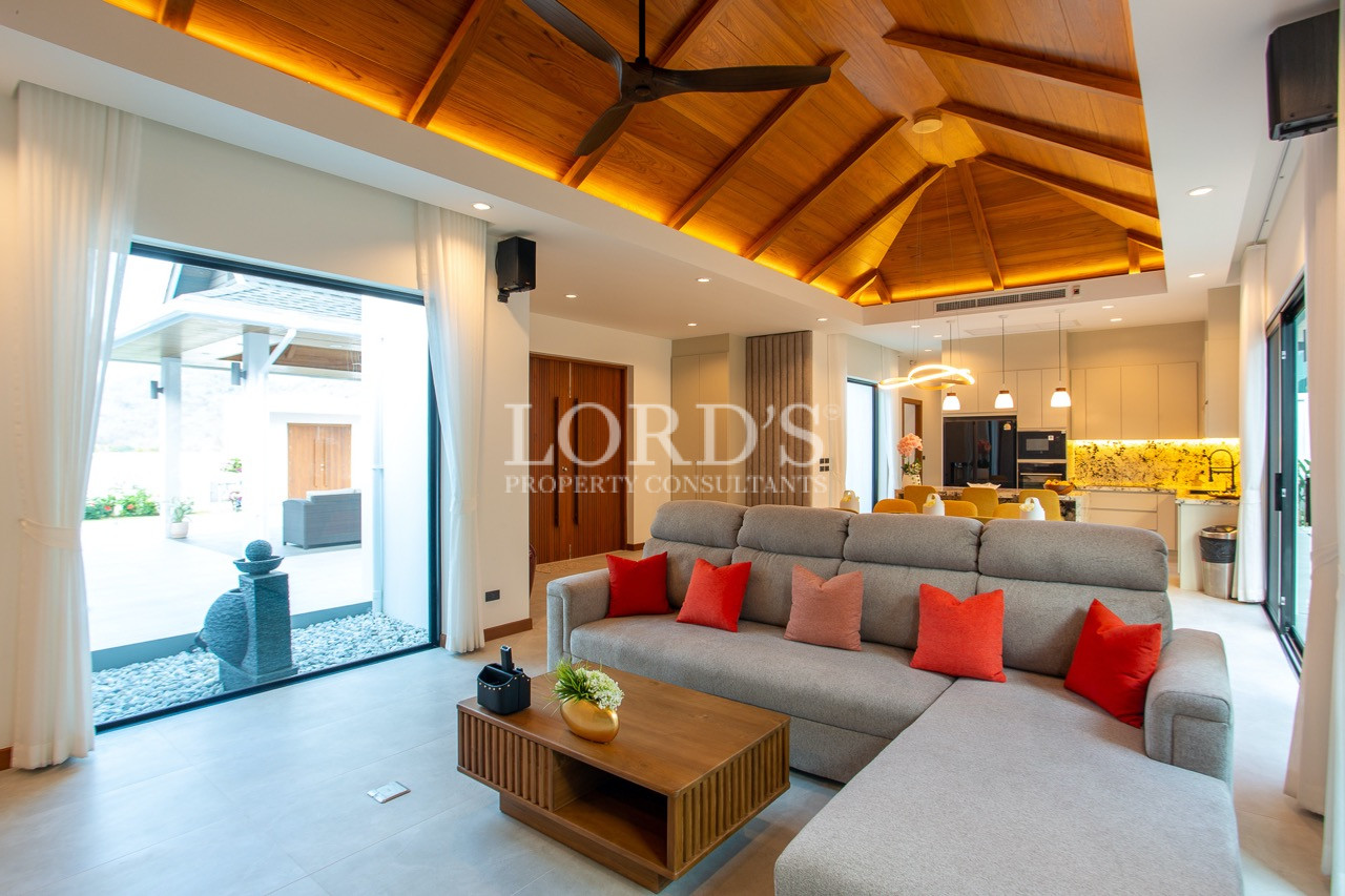 living room with wooden ceiling design