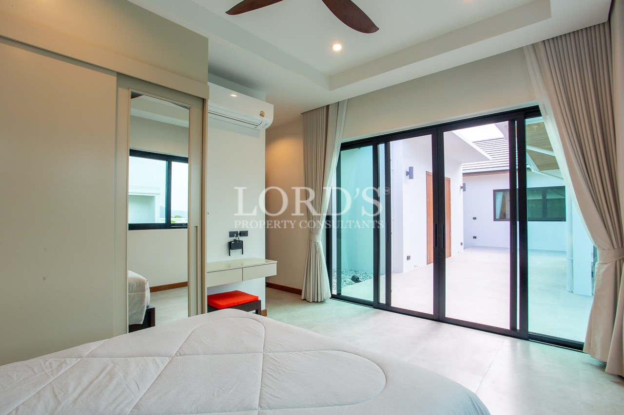 modern bedroom with balcony doors