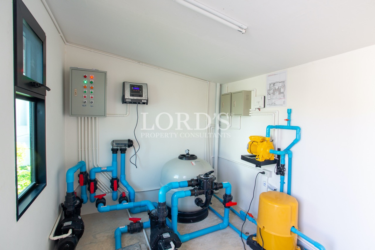 utility room with water system setup