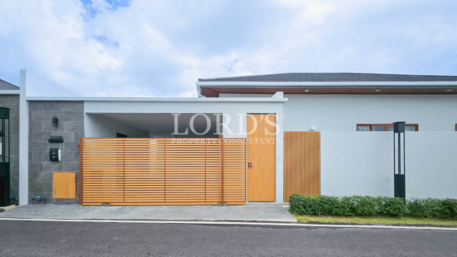 House exterior with wooden gate