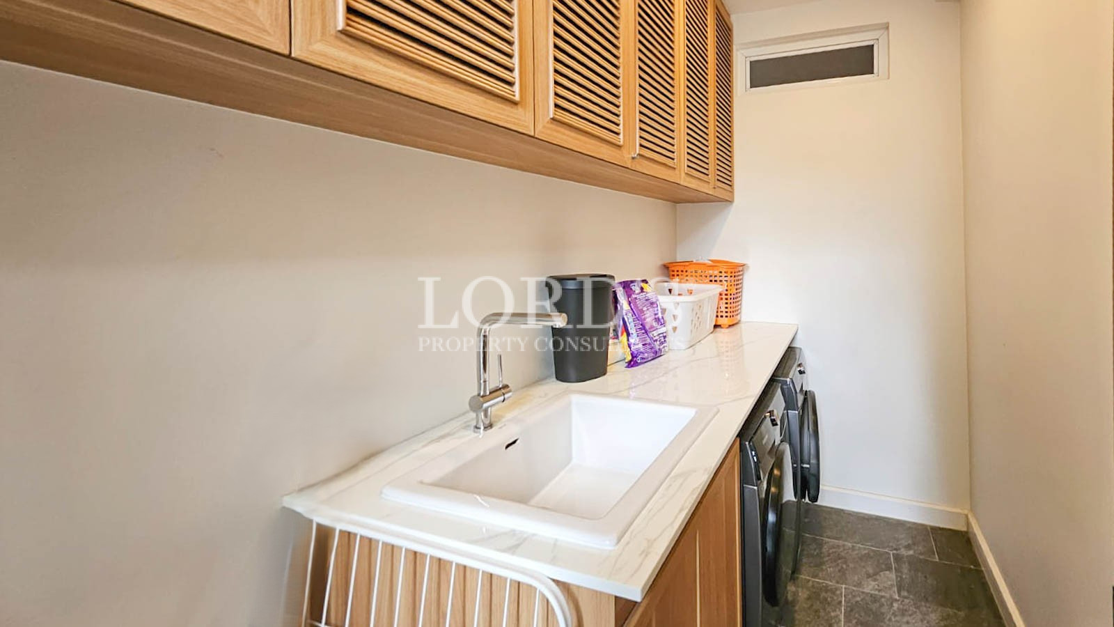 Laundry area with sink and cabinets