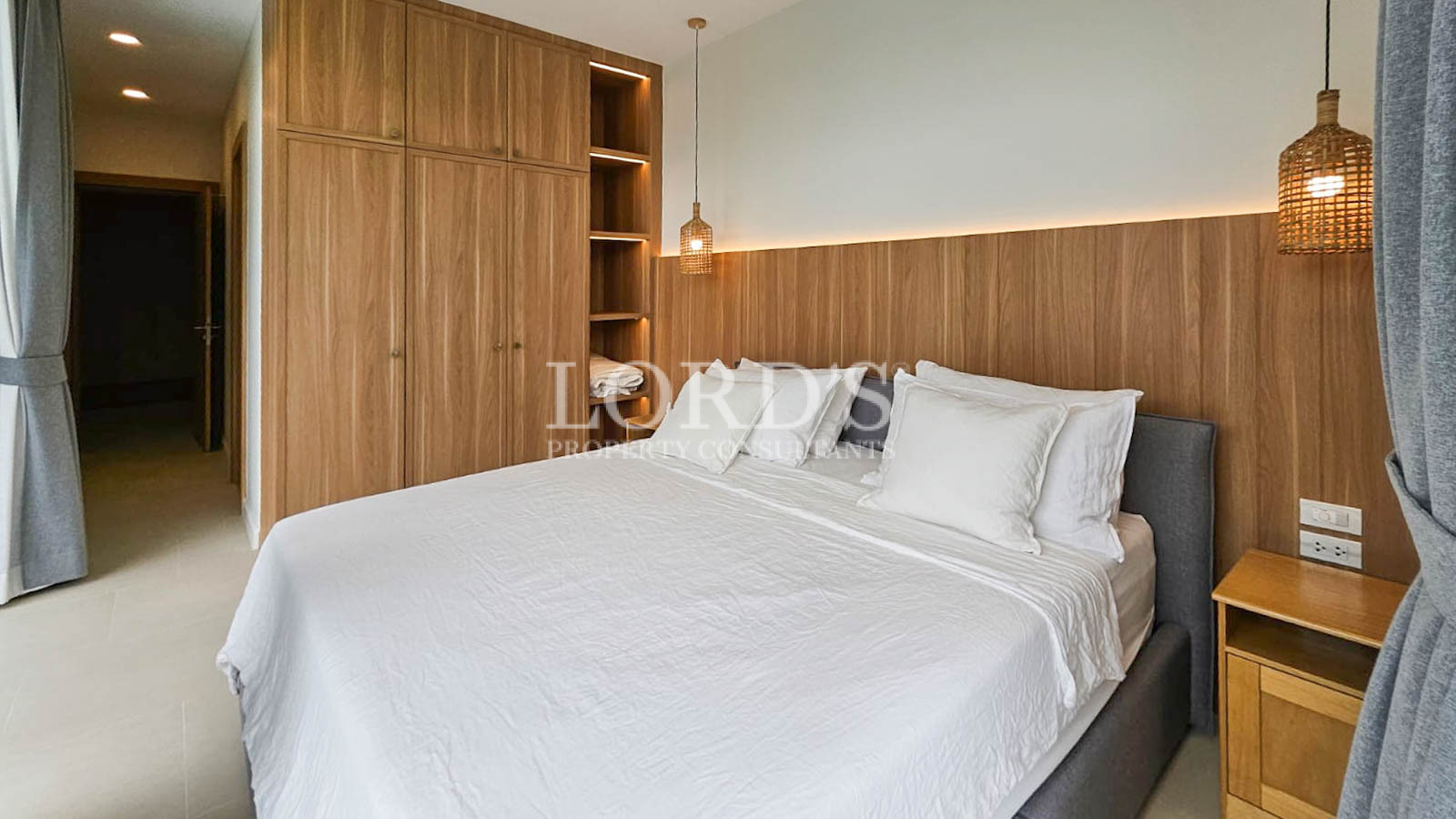 Bedroom with wooden headboard and decor