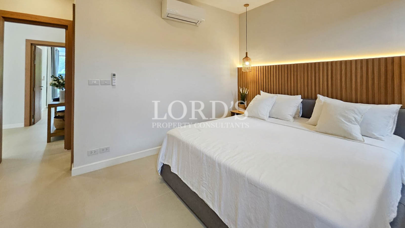 Bedroom with bed and wooden headboard