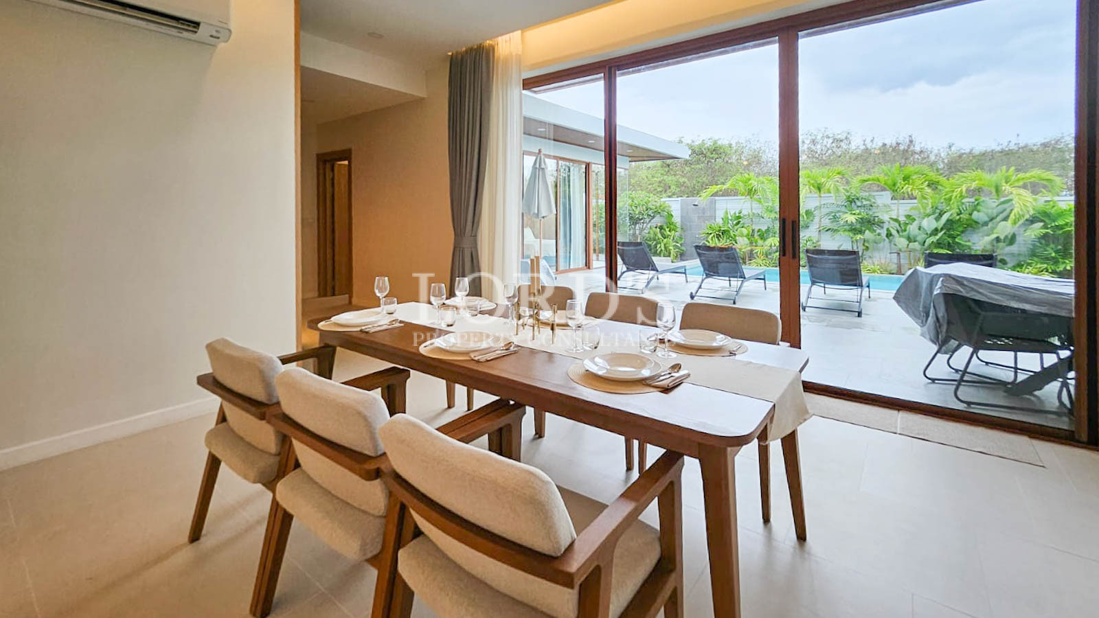 Dining table with chairs near window