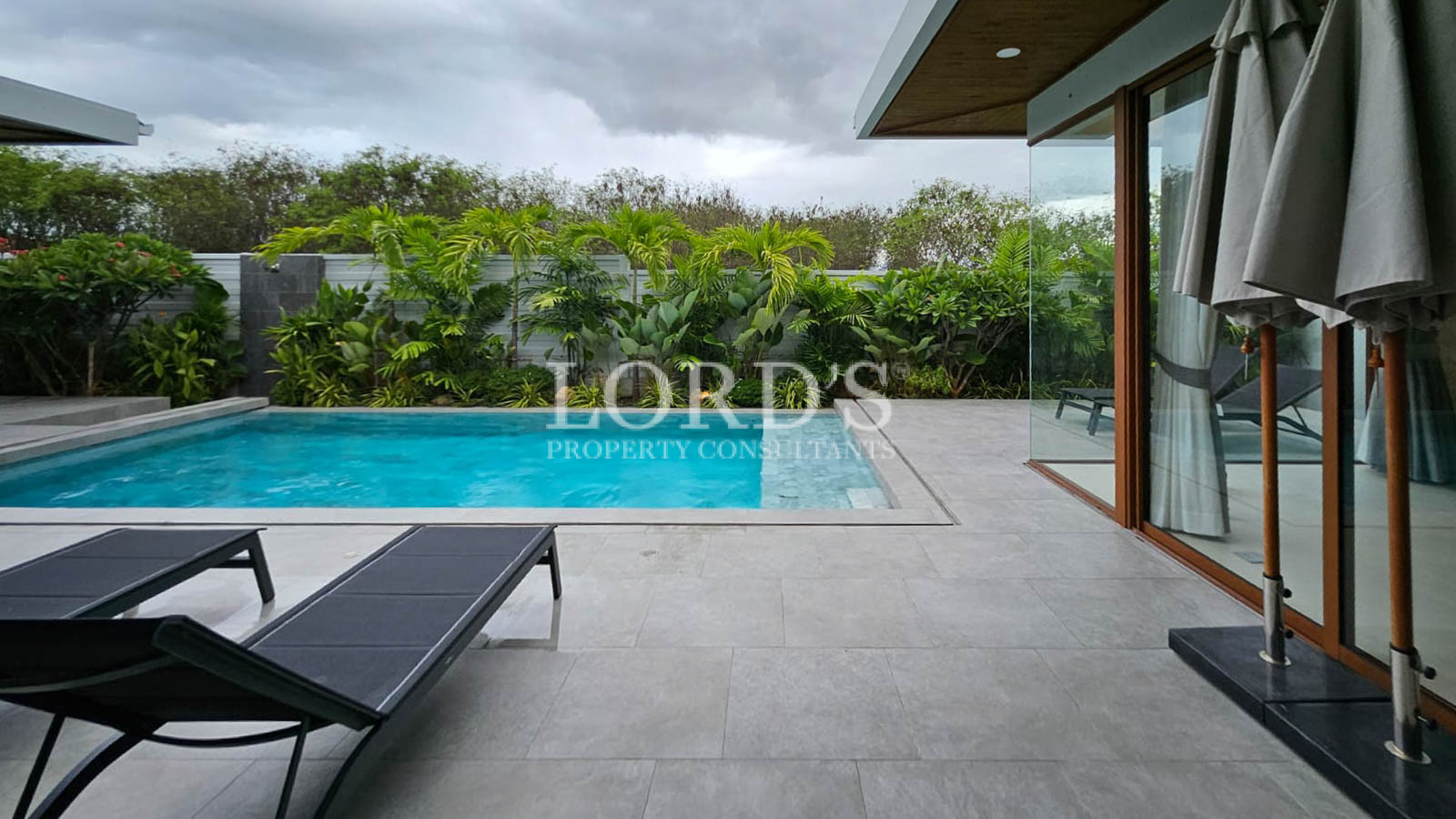 Poolside terrace with lounge chair