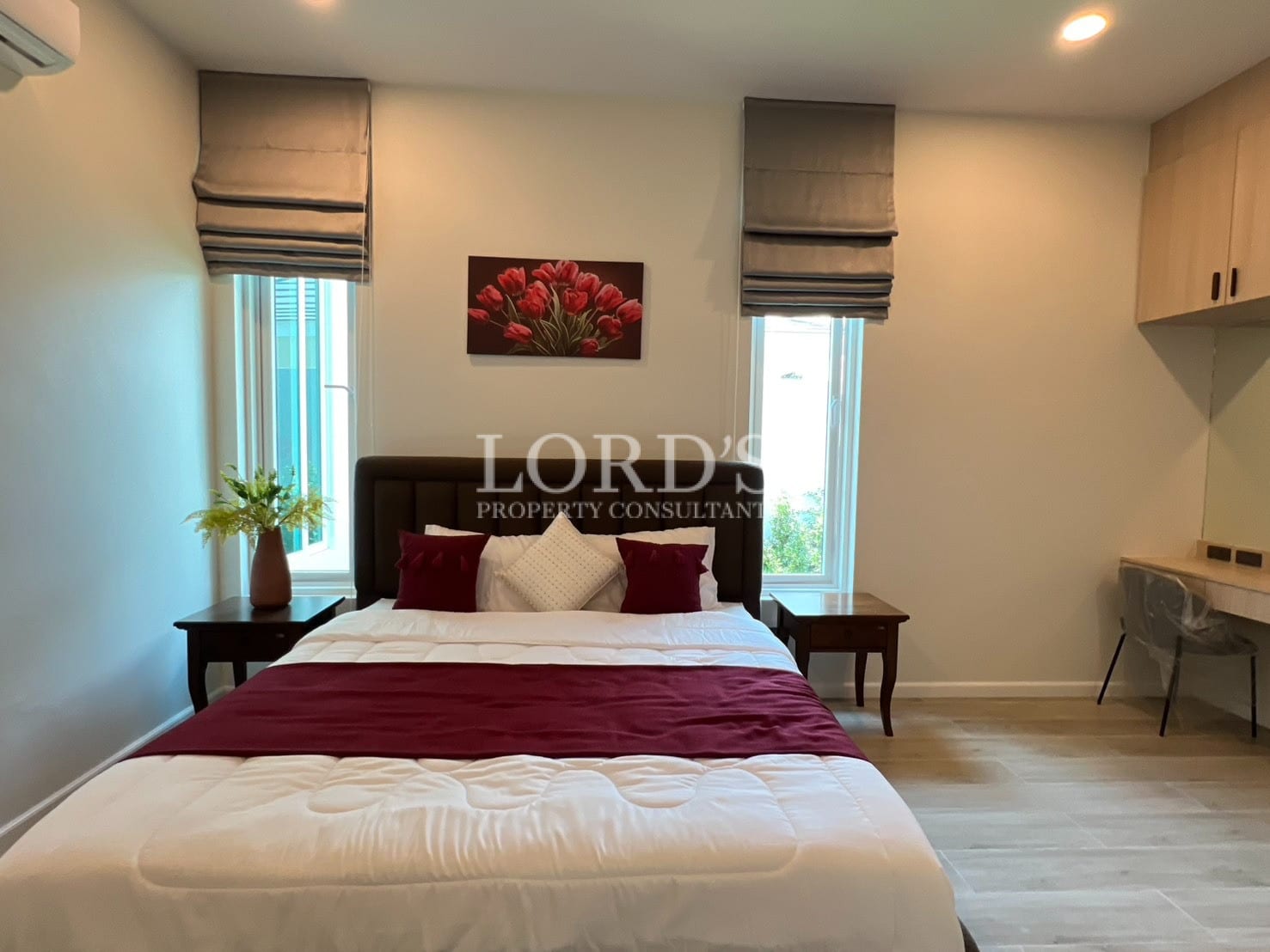 Bedroom with bed and artwork