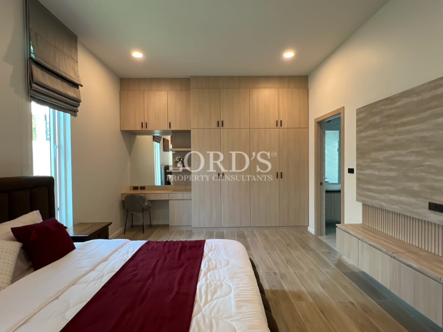 Bedroom with bed and wooden flooring