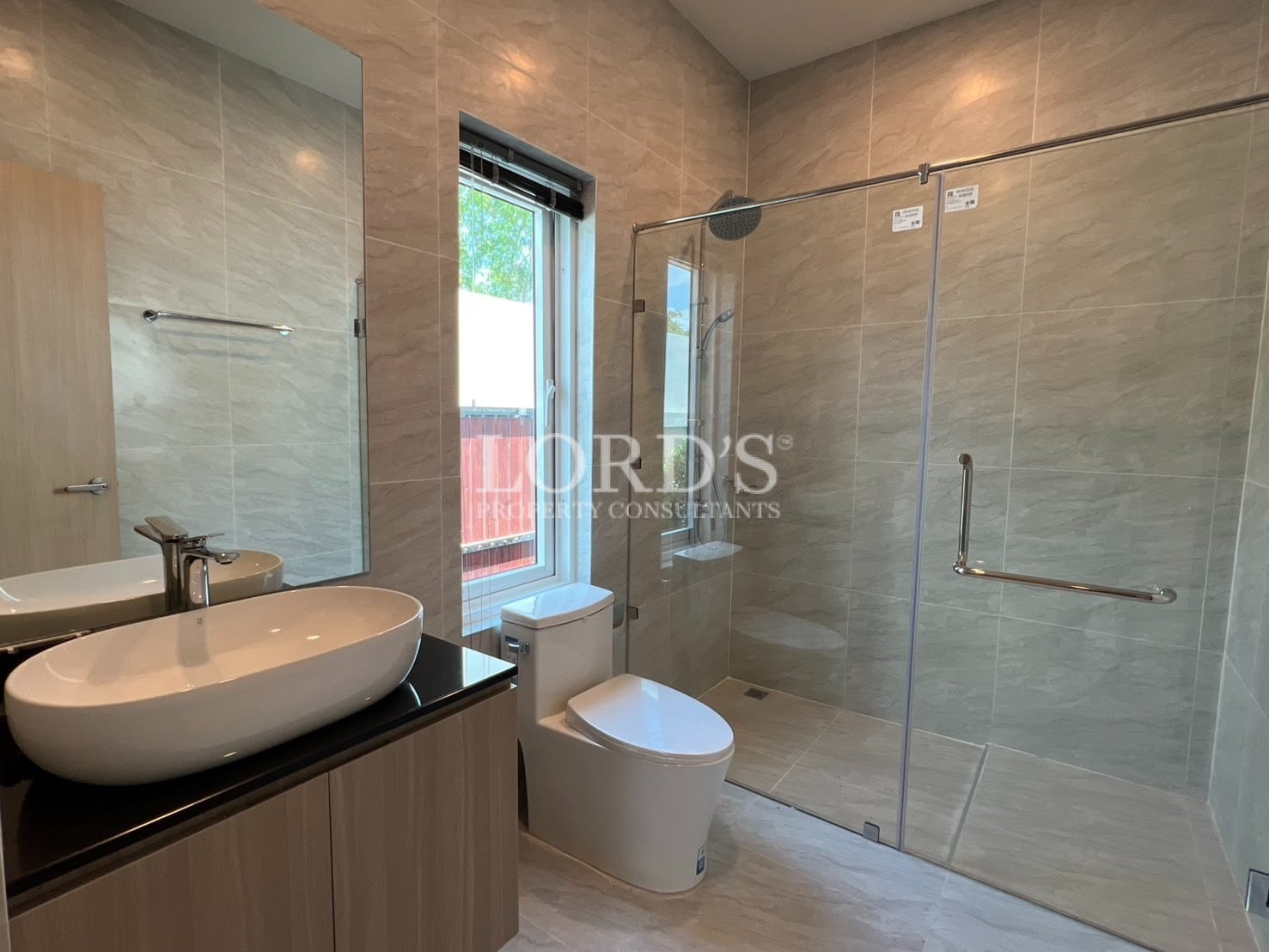 Bathroom with shower, sink, and modern fixtures