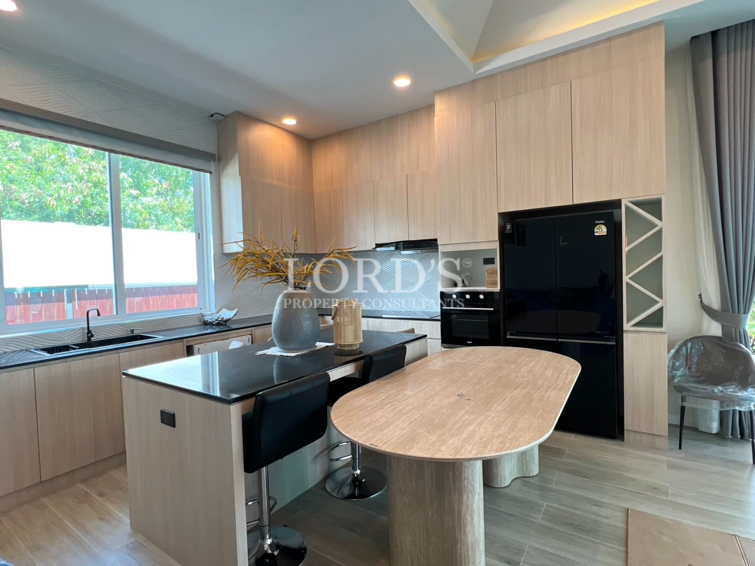 Kitchen with island table and modern appliances