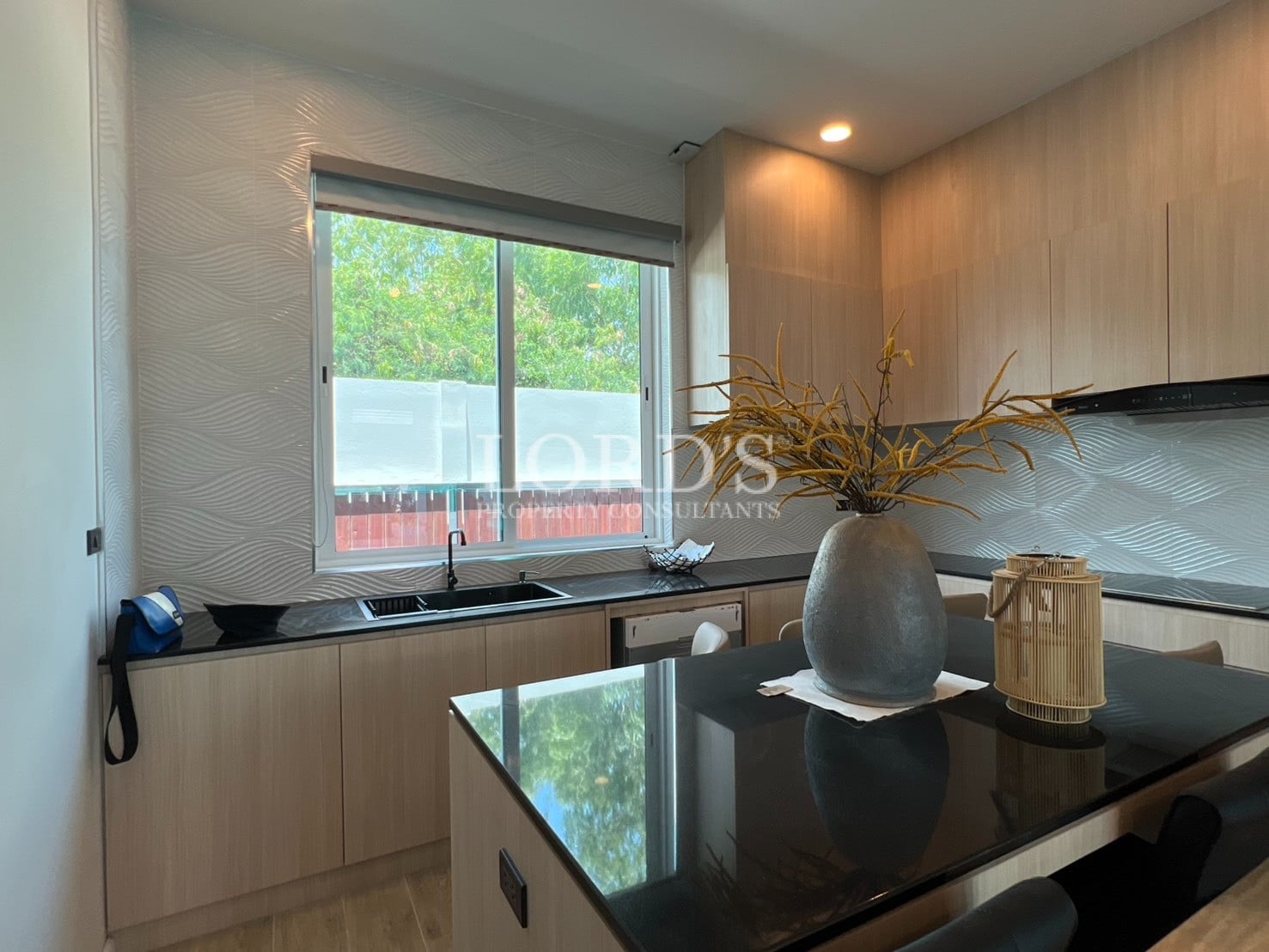 Kitchen with countertop, decor, and window view