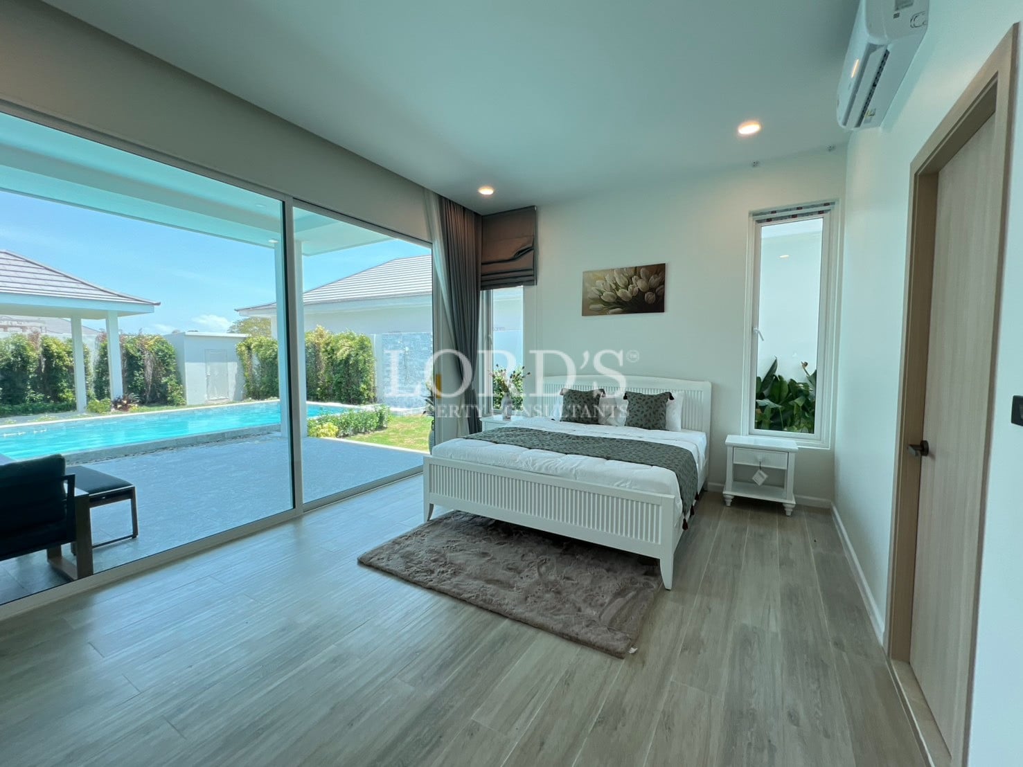 Bedroom with bed and glass wall view