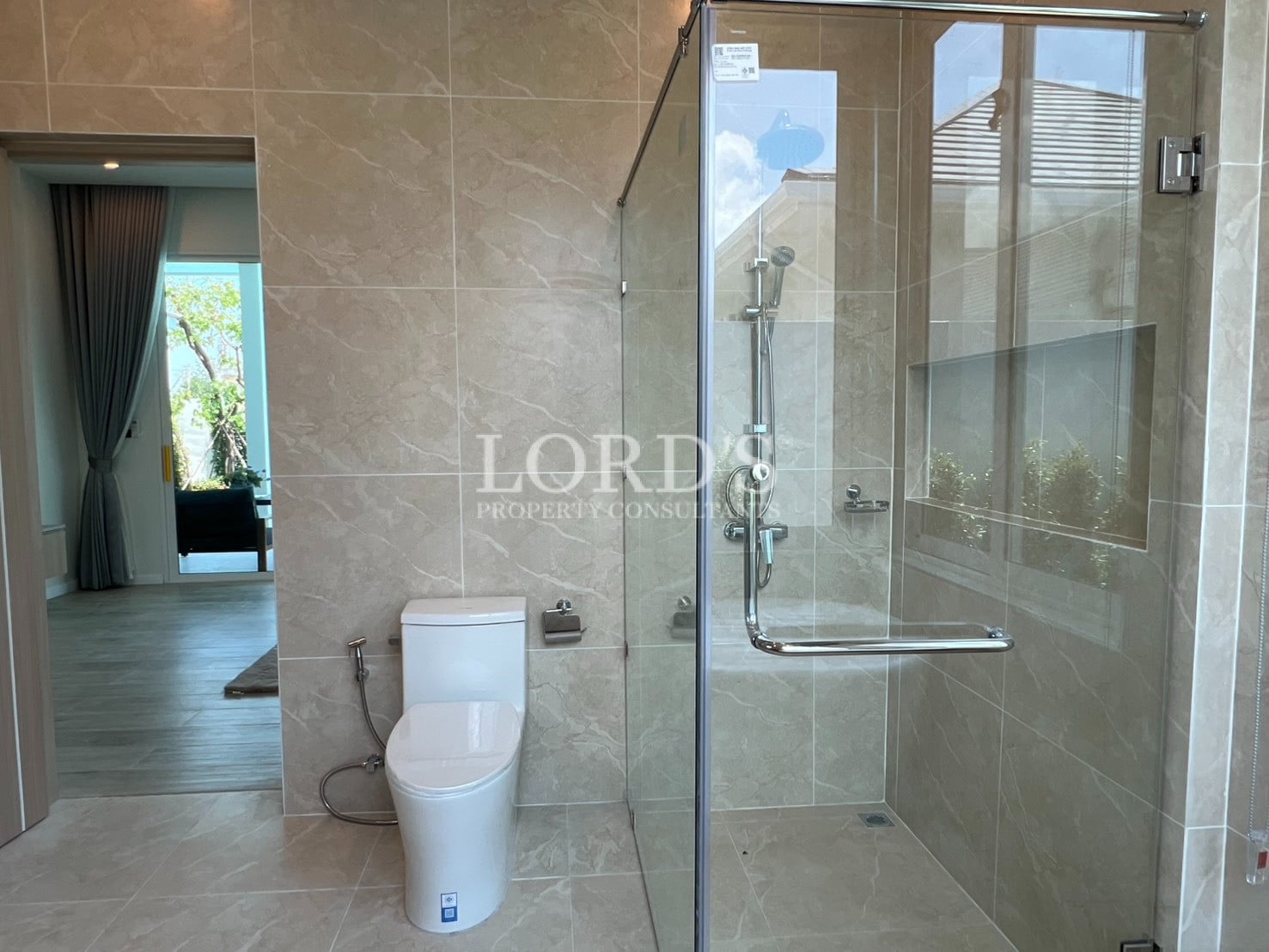 Bathroom with glass shower and toilet