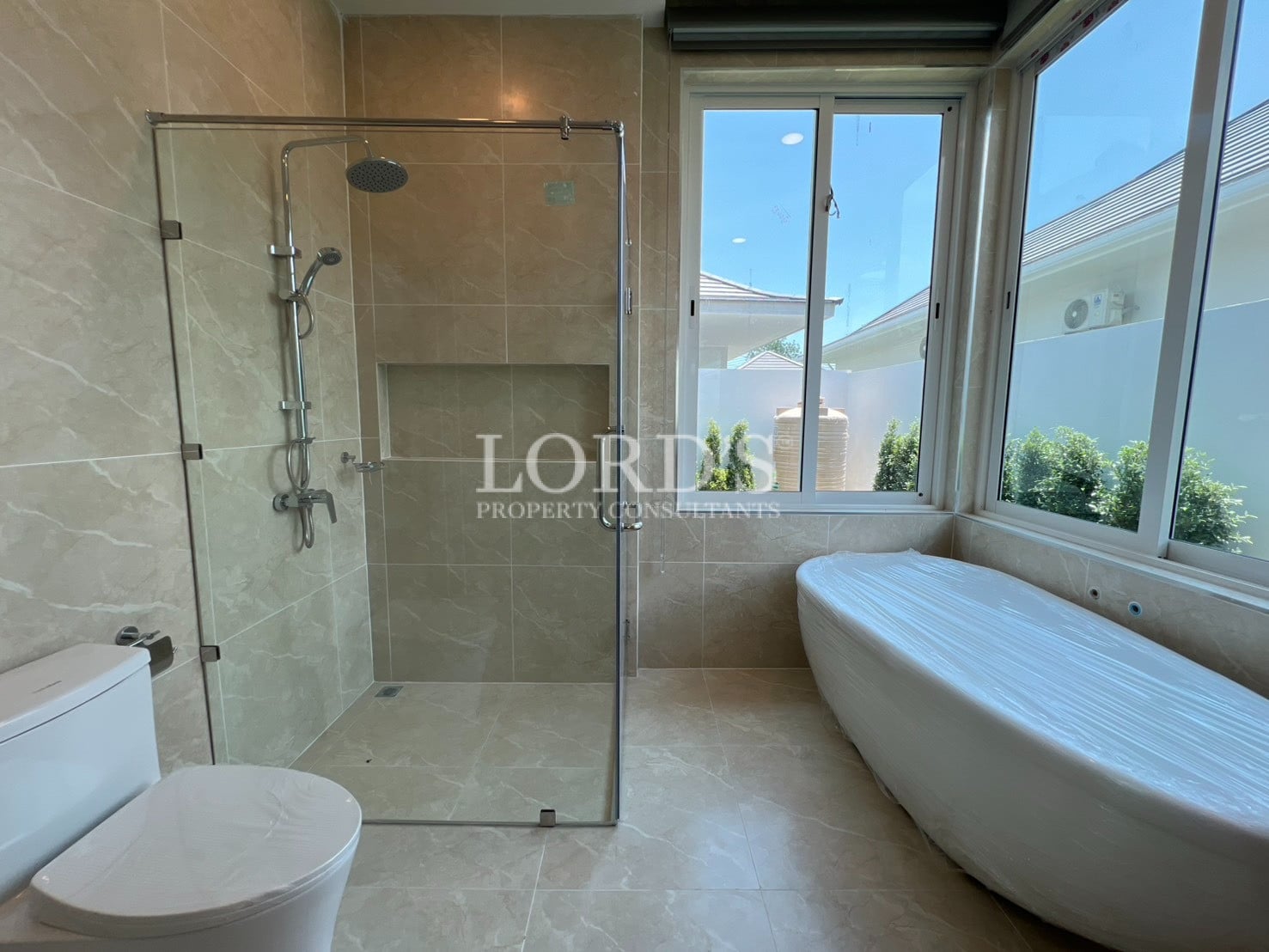Bathroom with bathtub and glass shower