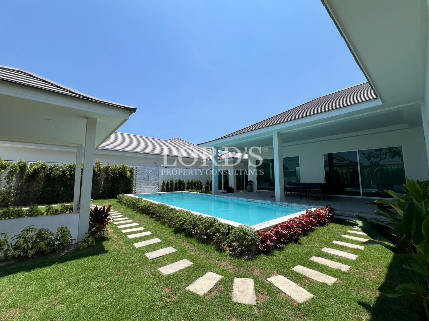 Poolside garden with curved stepping path