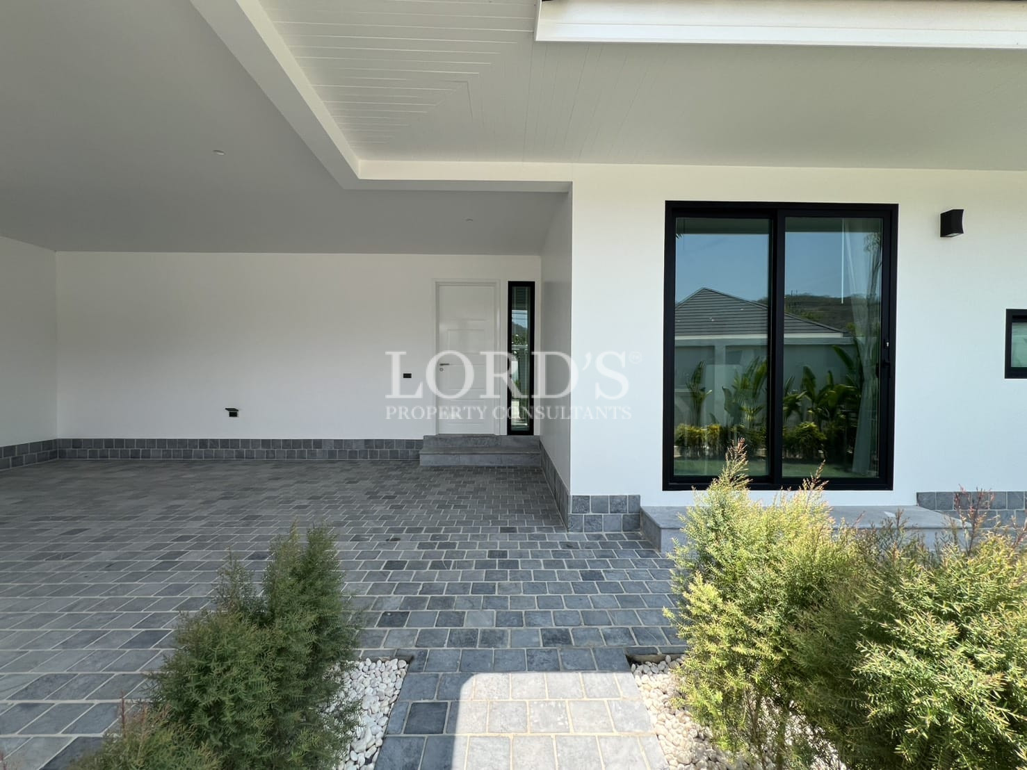 Exterior garden pathway with house view