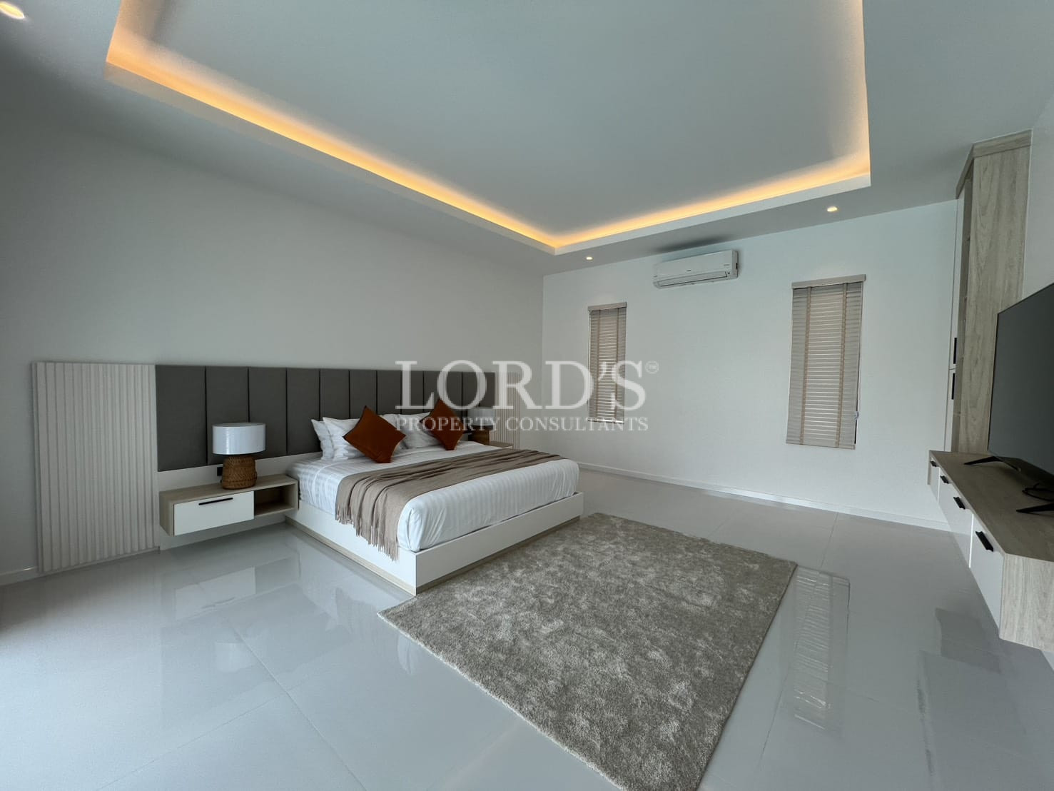 Bedroom with rug and modern lighting