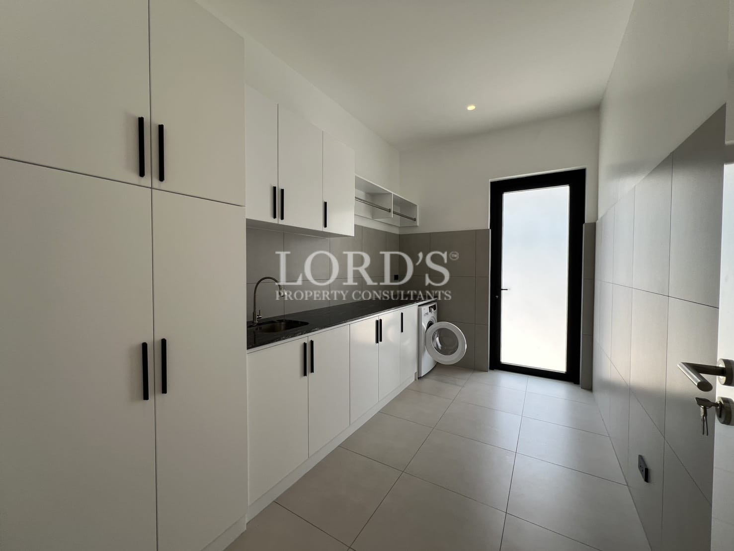 Built-in wardrobe with white cabinets